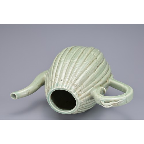 54 - A KOREAN MELON-SHAPED PORCELAIN EWER. With ribbed bamboo design. 18cm height.