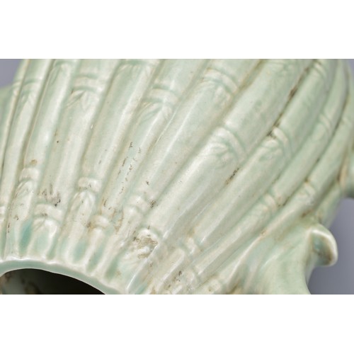 54 - A KOREAN MELON-SHAPED PORCELAIN EWER. With ribbed bamboo design. 18cm height.