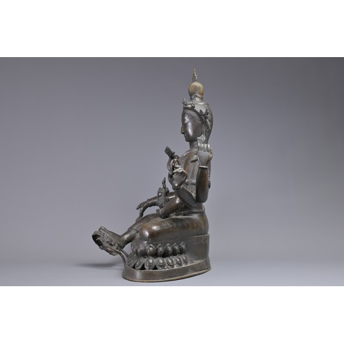 63 - A LARGE INDIAN BRONZE FIGURE OF VASUDHARA, 19/20TH CENTURY. The Goddess sat on a double lotus pedest... 