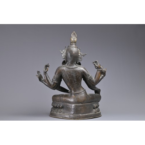 63 - A LARGE INDIAN BRONZE FIGURE OF VASUDHARA, 19/20TH CENTURY. The Goddess sat on a double lotus pedest... 