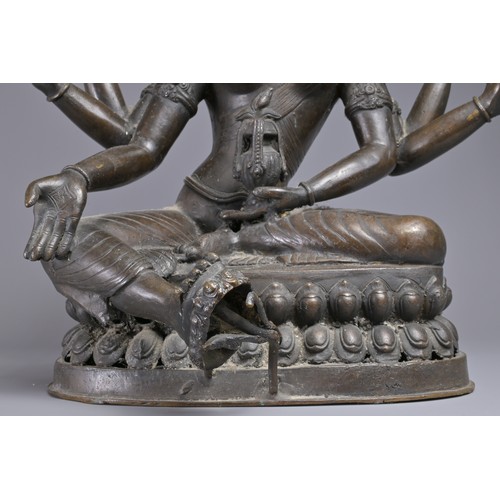 63 - A LARGE INDIAN BRONZE FIGURE OF VASUDHARA, 19/20TH CENTURY. The Goddess sat on a double lotus pedest... 