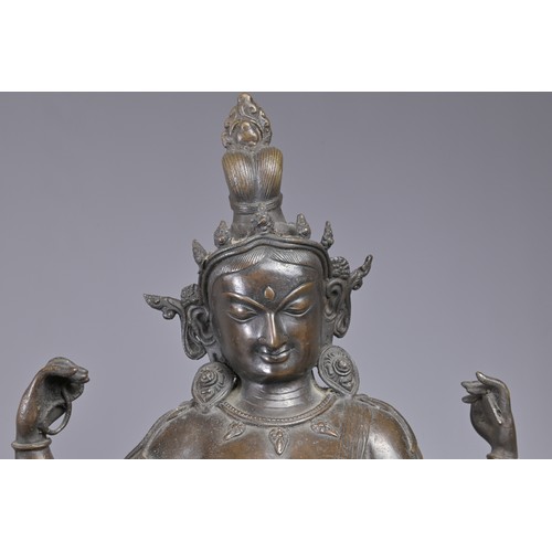 63 - A LARGE INDIAN BRONZE FIGURE OF VASUDHARA, 19/20TH CENTURY. The Goddess sat on a double lotus pedest... 