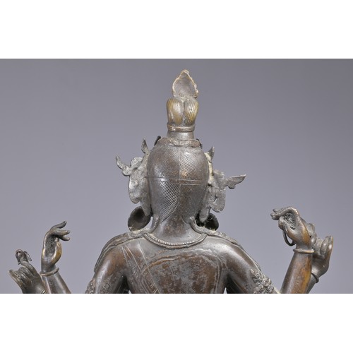 63 - A LARGE INDIAN BRONZE FIGURE OF VASUDHARA, 19/20TH CENTURY. The Goddess sat on a double lotus pedest... 