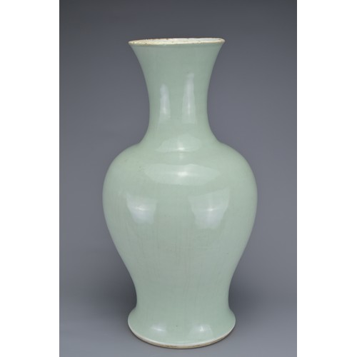 65 - A CHINESE PALE CELADON PORCELAIN BALUSTER VASE, 18/19TH CENTURY. Well-potted covered in a pale green... 