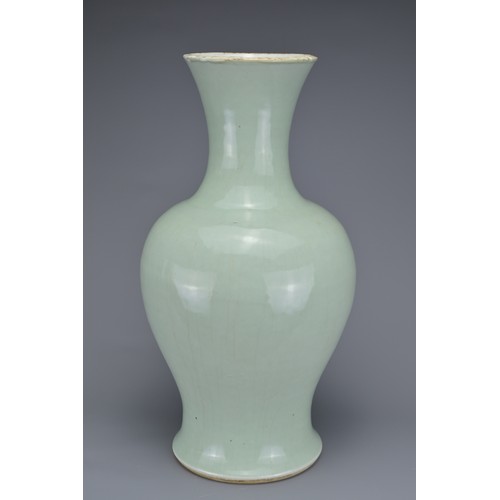 65 - A CHINESE PALE CELADON PORCELAIN BALUSTER VASE, 18/19TH CENTURY. Well-potted covered in a pale green... 