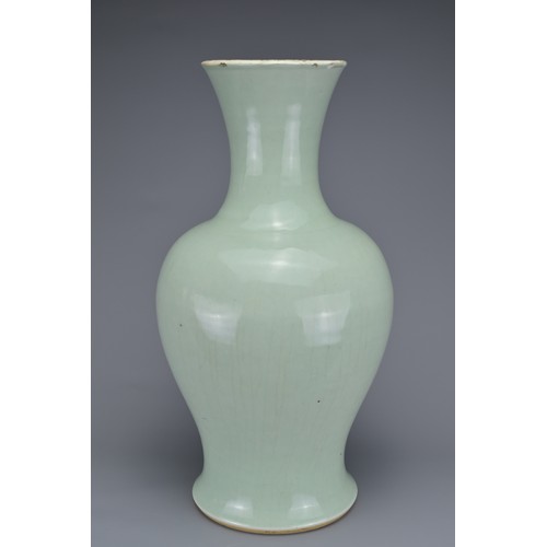 65 - A CHINESE PALE CELADON PORCELAIN BALUSTER VASE, 18/19TH CENTURY. Well-potted covered in a pale green... 