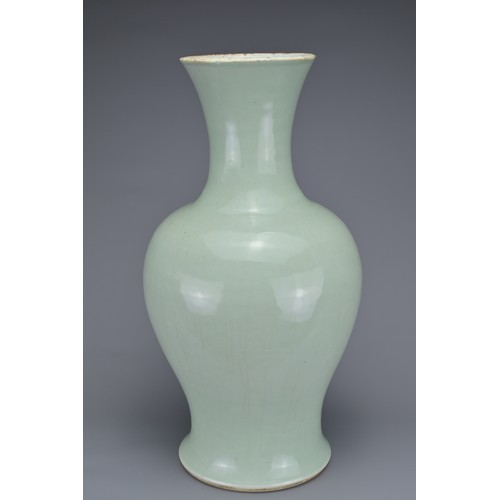 65 - A CHINESE PALE CELADON PORCELAIN BALUSTER VASE, 18/19TH CENTURY. Well-potted covered in a pale green... 