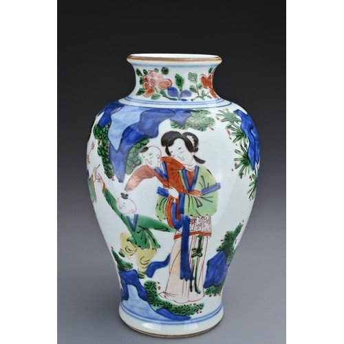 72 - A CHINESE WUCAI PORCELAIN JAR. Of baluster form decorated with ladies and children playing in landsc... 