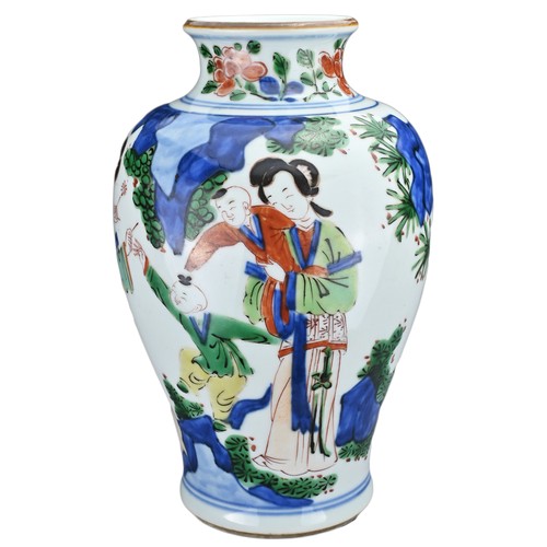 72 - A CHINESE WUCAI PORCELAIN JAR. Of baluster form decorated with ladies and children playing in landsc... 