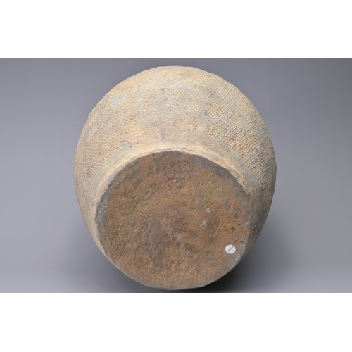 100 - A LARGE CHINESE WARRING STATES IMPRESSED POTTERY JAR. Relatively highly-fired, the whole outer surfa... 