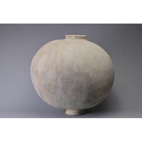 101 - A GIANT CHINESE POTTERY COCOON JAR – WARRING STATES. Heavily-potted, the surface decorated with repe... 