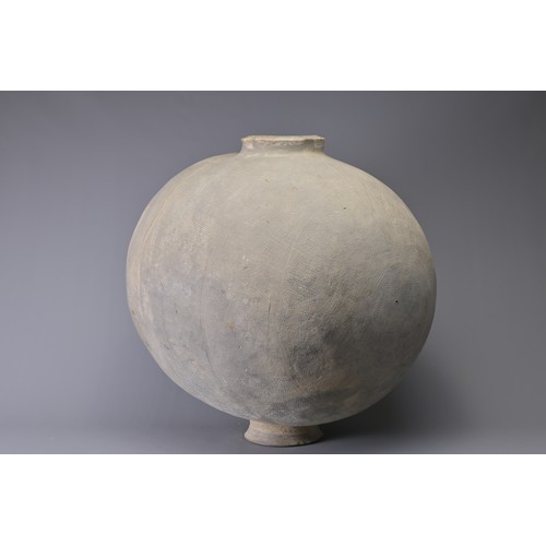 101 - A GIANT CHINESE POTTERY COCOON JAR – WARRING STATES. Heavily-potted, the surface decorated with repe... 