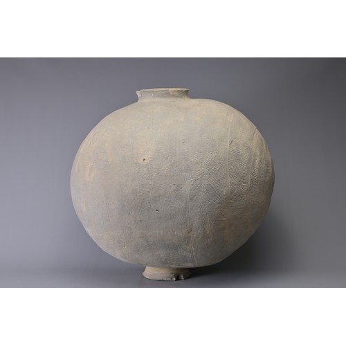 101 - A GIANT CHINESE POTTERY COCOON JAR – WARRING STATES. Heavily-potted, the surface decorated with repe... 