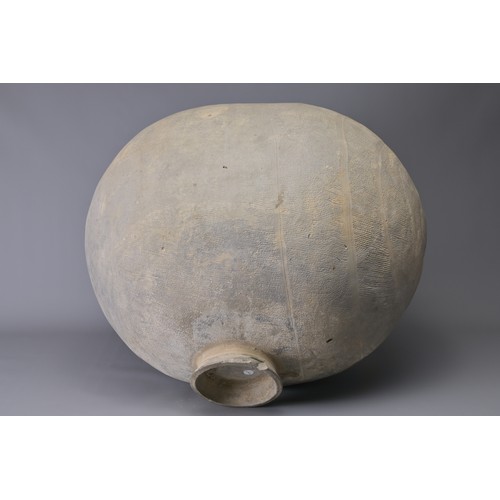 101 - A GIANT CHINESE POTTERY COCOON JAR – WARRING STATES. Heavily-potted, the surface decorated with repe... 