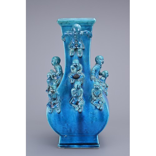 77 - A CHINESE TURQUOISE GLAZED PORCELAIN 'BOYS' VASE, 19TH CENTURY. The square from vase decorated with ... 