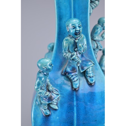 77 - A CHINESE TURQUOISE GLAZED PORCELAIN 'BOYS' VASE, 19TH CENTURY. The square from vase decorated with ... 