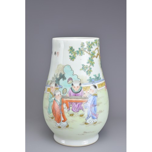 80 - THREE CHINESE PORCELAIN ITEMS, 20TH CENTURY. To include a Hu form vase decorated with children playi... 