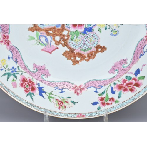 83 - A LARGE CHINESE FAMILLE ROSE EXPORT PORCELAIN DISH, 18TH CENTURY. With decorative scene of ornamenta... 