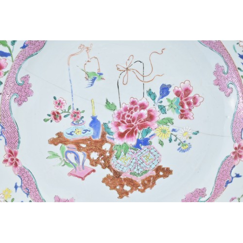 83 - A LARGE CHINESE FAMILLE ROSE EXPORT PORCELAIN DISH, 18TH CENTURY. With decorative scene of ornamenta... 