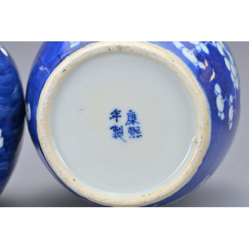 87 - THREE CHINESE BLUE AND WHITE PORCELAIN GINGER JARS, 19/20TH CENTURY. Of graduating sizes with prunus... 