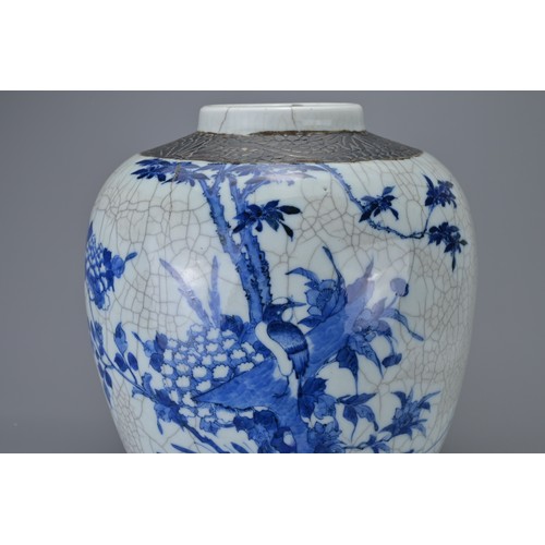 89 - A CHINESE BLUE AND WHITE CRACKLE PORCELAIN GINGER JAR, 19TH CENTURY. Decorated with birds in landsca... 