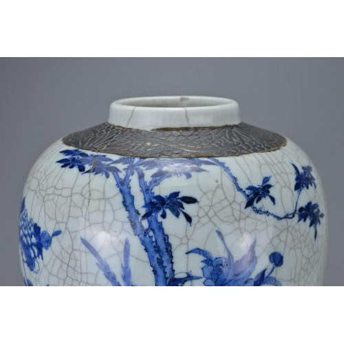 89 - A CHINESE BLUE AND WHITE CRACKLE PORCELAIN GINGER JAR, 19TH CENTURY. Decorated with birds in landsca... 