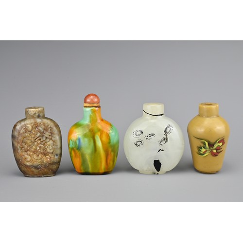 1 - FOUR CHINESE SNUFF BOTTLES. Comprising a polychrome glazed ceramic bottle with carnelian stopper; a ... 