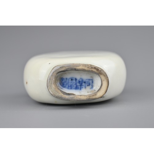 3 - TWO CHINESE PORCELAIN SNUFF BOTTLES, 19TH CENTURY. To include an ovoid blue and white porcelain snuf... 