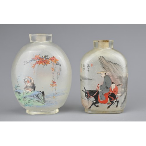 7 - TWO INSIDE-PAINTED GLASS SNUFF BOTTLES. To include an ovoid bottle painted with monkey and goats in ... 