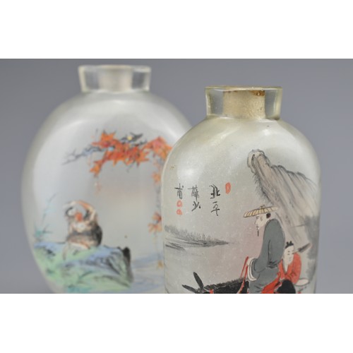 7 - TWO INSIDE-PAINTED GLASS SNUFF BOTTLES. To include an ovoid bottle painted with monkey and goats in ... 