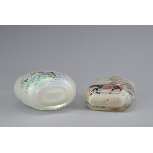 7 - TWO INSIDE-PAINTED GLASS SNUFF BOTTLES. To include an ovoid bottle painted with monkey and goats in ... 