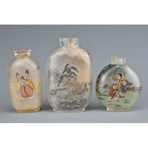 17 - THREE CHINESE INSIDE-PAINTED GLASS SNUFF BOTTLES. Depicting various figures and landscape scenes. 6-... 