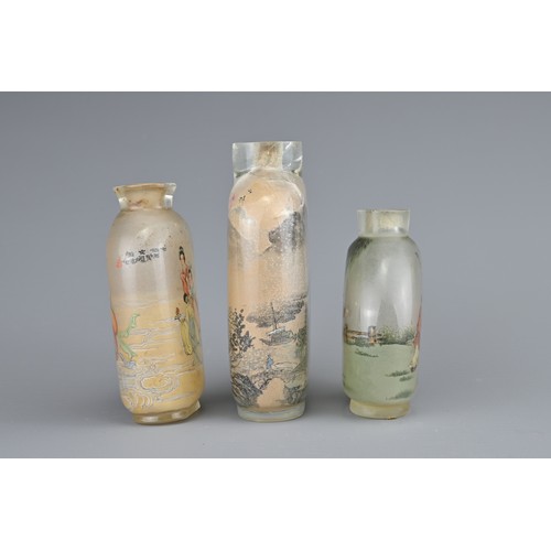 17 - THREE CHINESE INSIDE-PAINTED GLASS SNUFF BOTTLES. Depicting various figures and landscape scenes. 6-... 