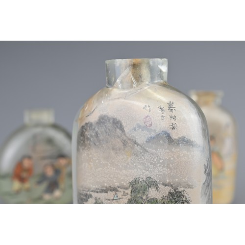 17 - THREE CHINESE INSIDE-PAINTED GLASS SNUFF BOTTLES. Depicting various figures and landscape scenes. 6-... 