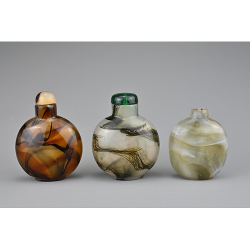 18 - THREE CHINESE GLASS SNUFF BOTTLES. Coloured glass imitation agate with splashes of black. Two with g... 