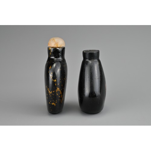 19 - TWO CHINESE GLASS SNUFF BOTTLES. To include an aventurine glass bottle with gold flecks and stone st... 