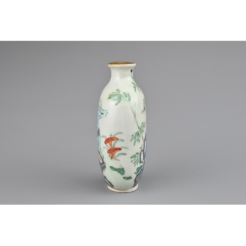 20 - A CHINESE PORCELAIN SNUFF BOTTLE, LATE 19TH CENTURY. Decorated in polychrome enamels and iron-red wi... 