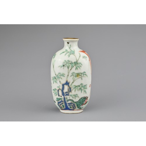 20 - A CHINESE PORCELAIN SNUFF BOTTLE, LATE 19TH CENTURY. Decorated in polychrome enamels and iron-red wi... 