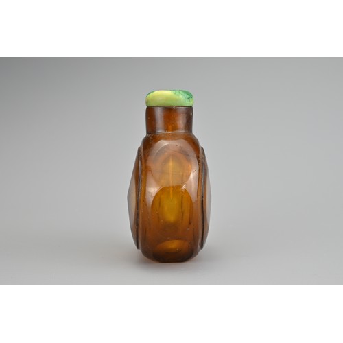 30 - AN AMBER FACETED GLASS SNUFF BOTTLE, QING DYNASTY. The amber coloured transparent glass in octagonal... 