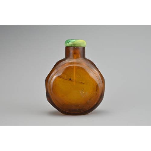 30 - AN AMBER FACETED GLASS SNUFF BOTTLE, QING DYNASTY. The amber coloured transparent glass in octagonal... 