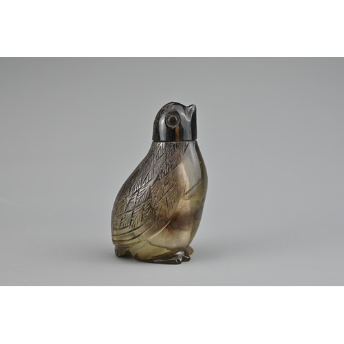 35 - AN UNUSUAL SMOKY QUARTZ CRYSTAL 'QUAIL' SNUFF BOTTLE, QING DYNASTY. The bottle and cover carved in t... 