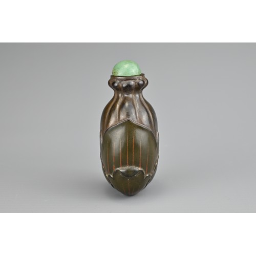 36 - AN UNUSUAL CHINESE LACQUER 'FRUIT' SNUFF BOTTLE, QING DYNASTY. Carved and painted lacquer with green... 