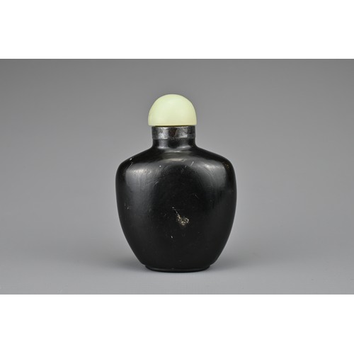 38 - AN UNUSUAL CHINESE BLACK LACQUERED SNUFF BOTTLE, QING DYNASTY. Undecorated with raised seal mark to ... 