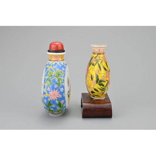 42 - TWO VINTAGE CHINESE GLASS SNUFF BOTTLES. Each decorated in polychrome enamels, one yellow ground wit... 