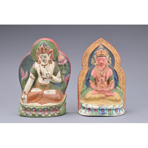 55 - CHINESE LACQUERED POTTERY BUDDHAS AND JADE PENDANTS, QING DYNASTY. Two figures of Buddha seated on l... 