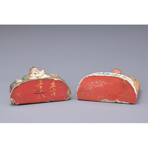 55 - CHINESE LACQUERED POTTERY BUDDHAS AND JADE PENDANTS, QING DYNASTY. Two figures of Buddha seated on l... 