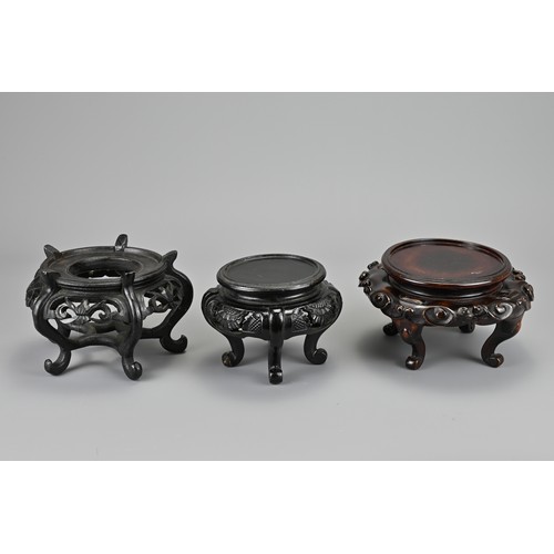 58 - A GROUP OF CHINESE / JAPANESE CARVED WOOD AND LACQUER DISPLAY STANDS. Each of various shapes and siz... 