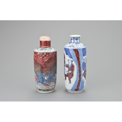 45 - TWO CHINESE UNDERGLAZE BLUE AND COPPER RED PORCELAIN SNUFF BOTTLES, QING DYNASTY. Both of cylindrica... 