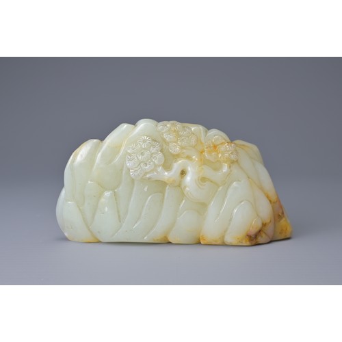 60 - A CHINESE PALE CELADON AND RUSSET JADE CARVING. Depicting two cranes on a rock formation with pine t... 