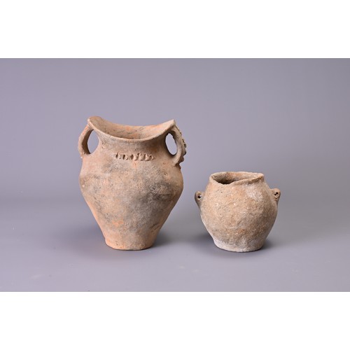 191 - TWO CHINESE NEOLITHIC POTTERY JARS. To include a Siwa pottery jar with saddle like rim and two stap ... 